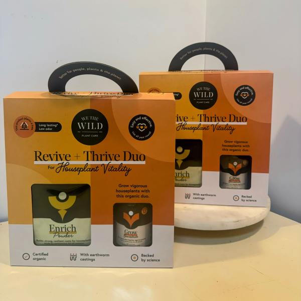 Two plant care gift boxes on a table