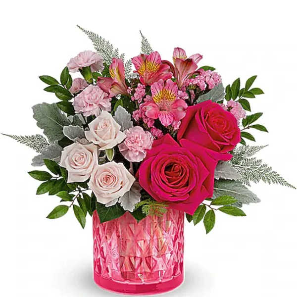 Pink and white rose bouquet in a pink glass vase