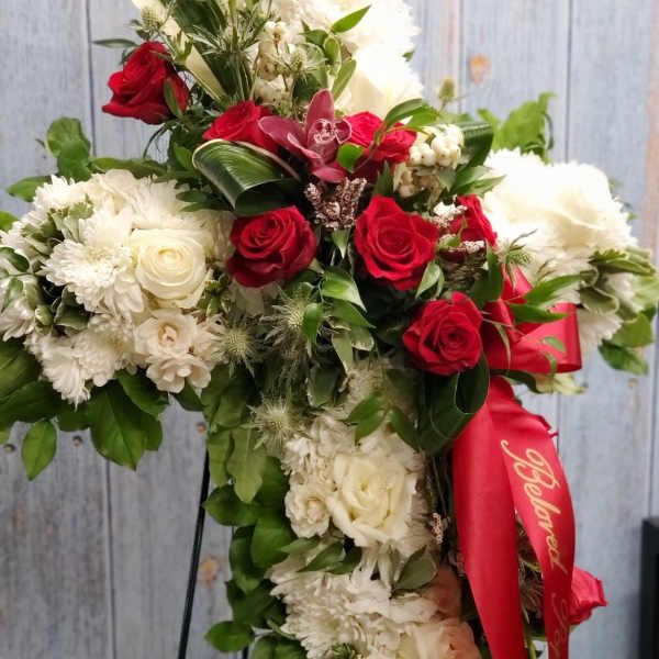Standing floral spray with red and white roses and chrysanthemums