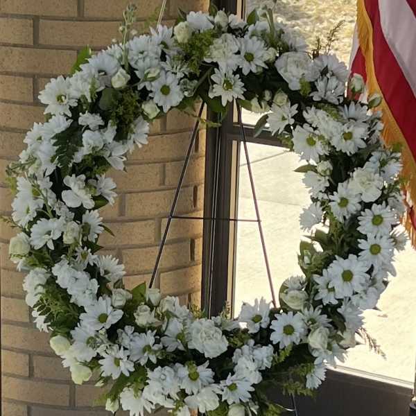 White daisy wreath on a standing easel