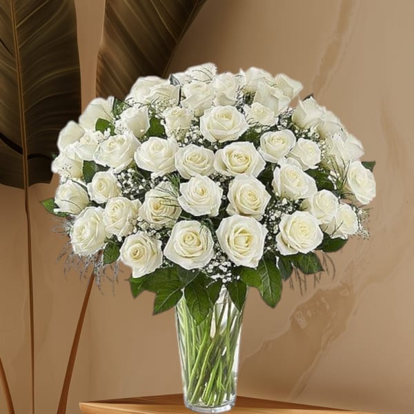Bouquet of white roses in a clear glass vase