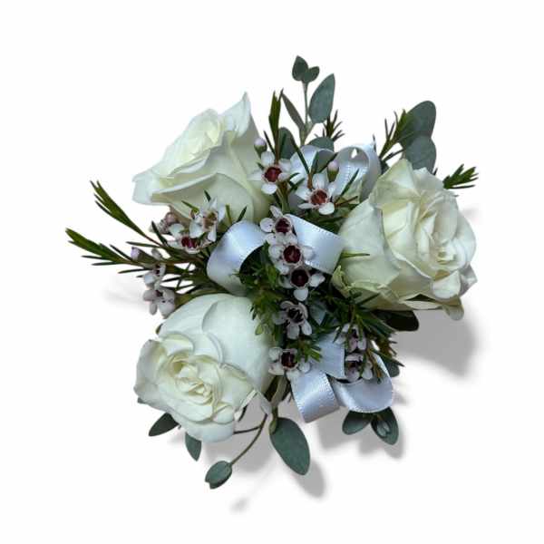 White rose bouquet with small white flowers and a pale ribbon
