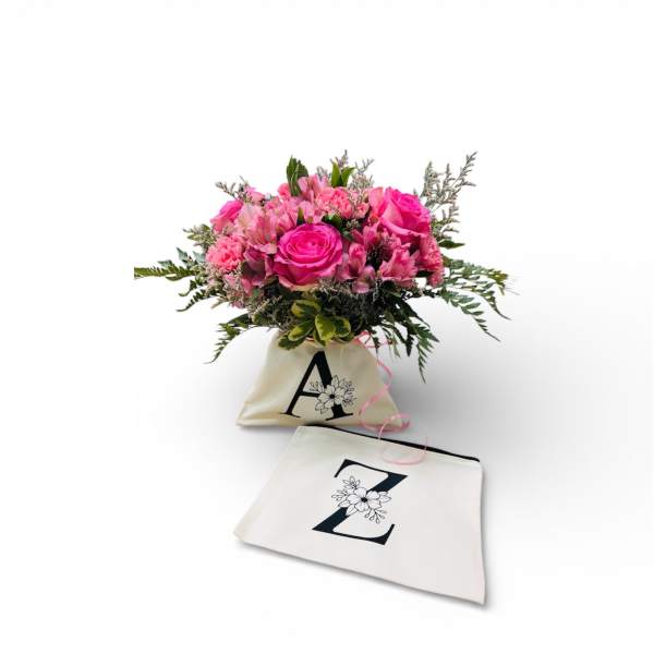 Pink rose bouquet in a cream tote bag with a matching pouch