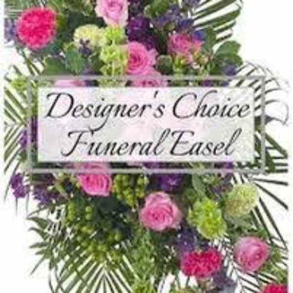 Colorful funeral easel spray with pink and purple flowers