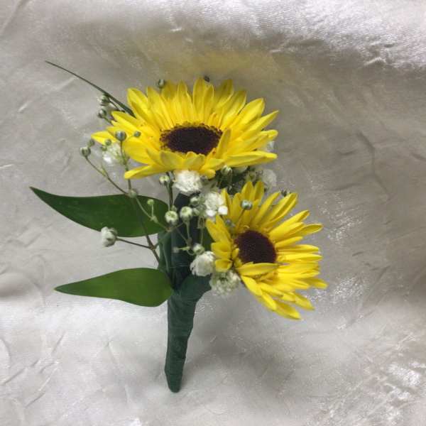Two yellow sunflowers with small white filler flowers