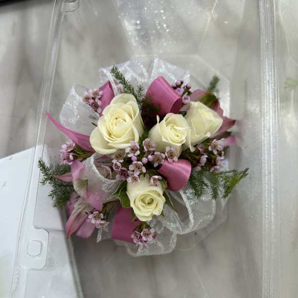 Small bouquet of cream roses and pink filler flowers with ribbon