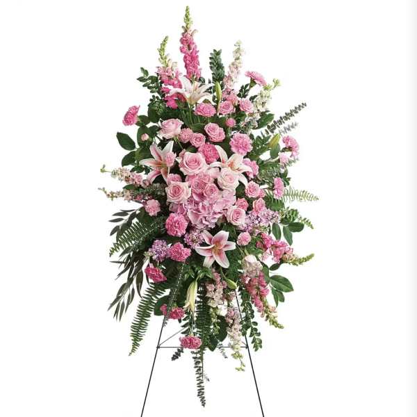 Tall pink floral standing spray on an easel