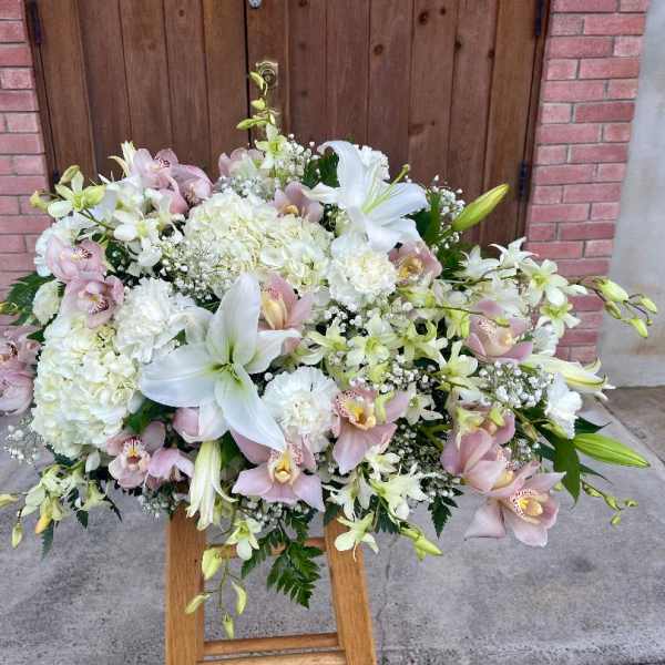 white and pink casket or Urn spray