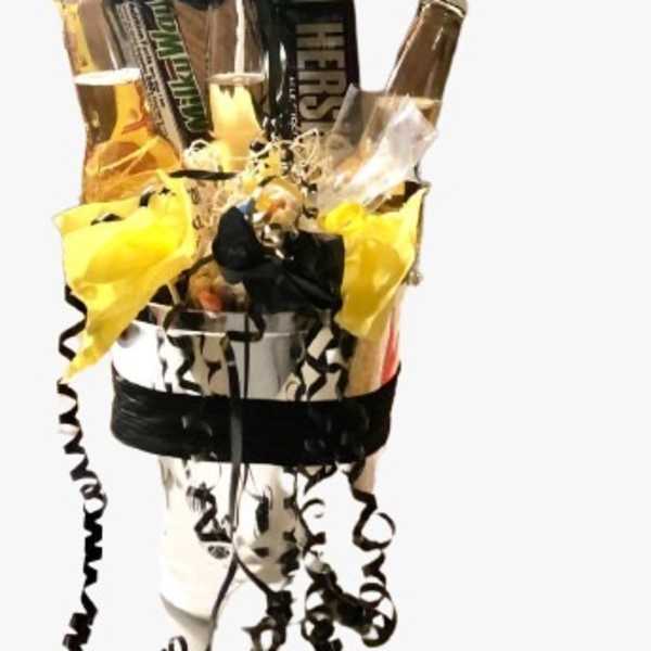 Balloon-topped gift arrangement with beer bottles and candy bars