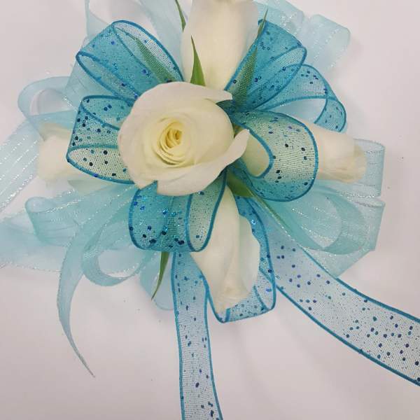 White rose boutonniere with blue ribbon loops