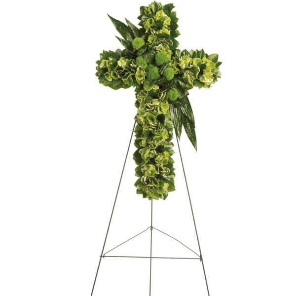 Green floral cross on a metal easel