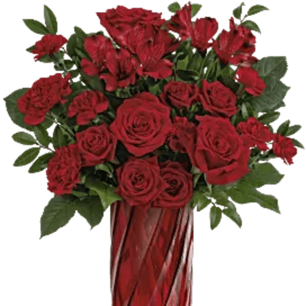 Red roses and carnations in a tall red glass vase