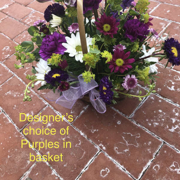 Purple and white mixed flower basket with a ribbon handle