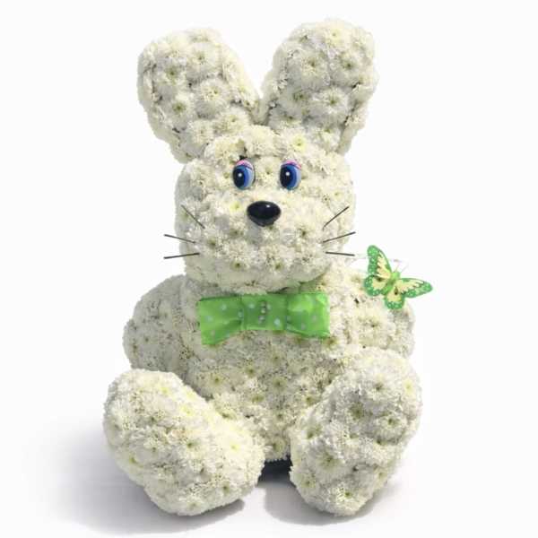 White flower bunny with a green bow tie and butterfly accent