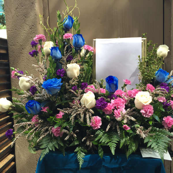 Picture or Urn arrangement with blue and white roses