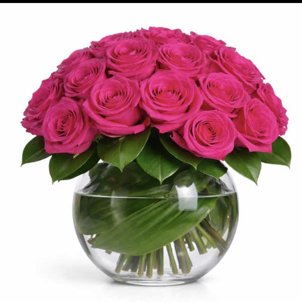 Hot pink roses arranged in a clear glass vase