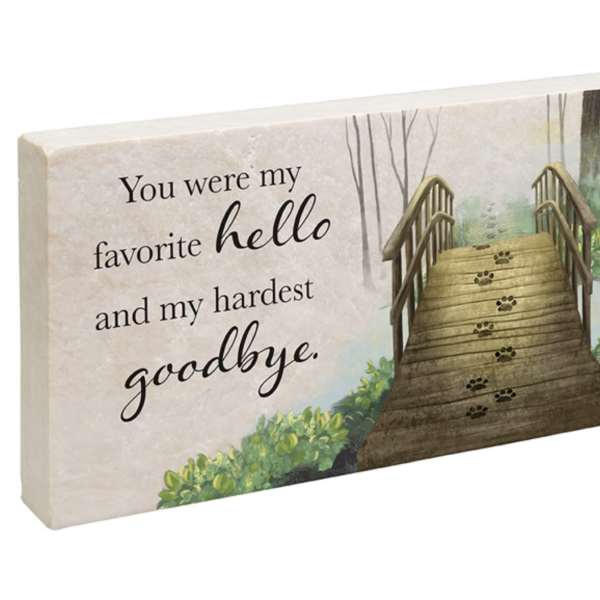 Decorative memorial sign with a bridge and the words "You were my favorite hello and my hardest goodbye."