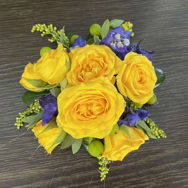 Yellow rose bouquet with purple flowers and green accents