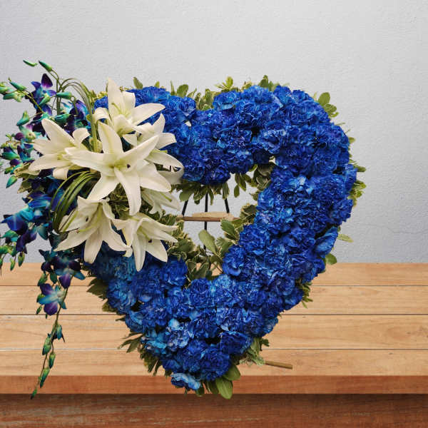 Blue floral heart wreath with white lilies and purple orchids