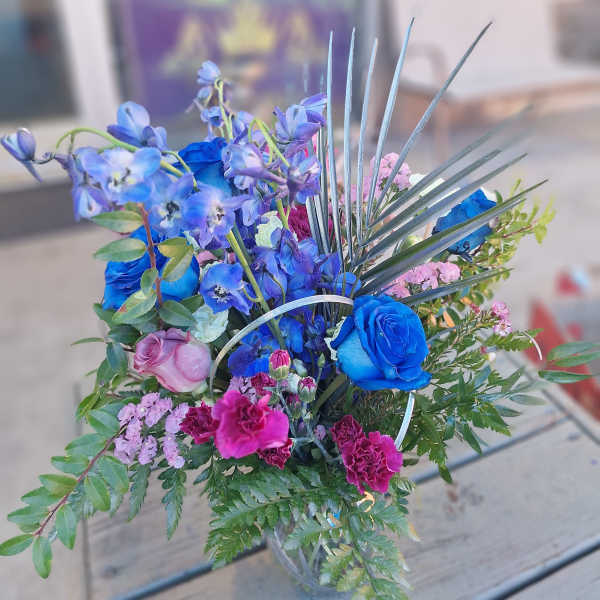Blue and pink mixed bouquet with roses and tall spiky foliage