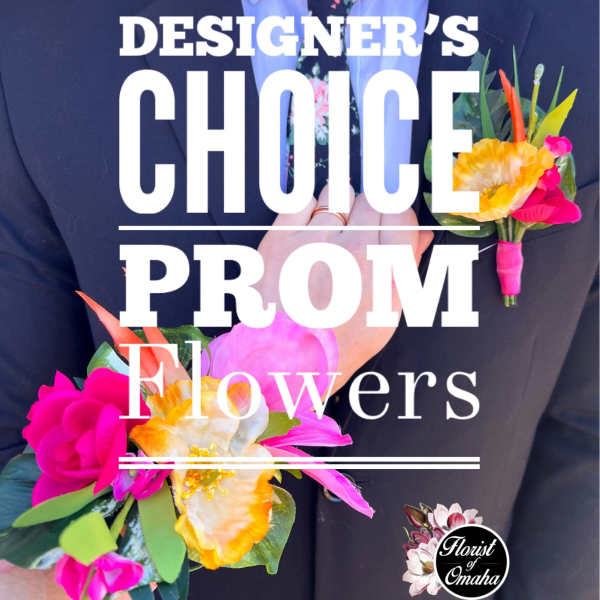 Person in a suit holding a bright floral boutonniere and wrist corsage.