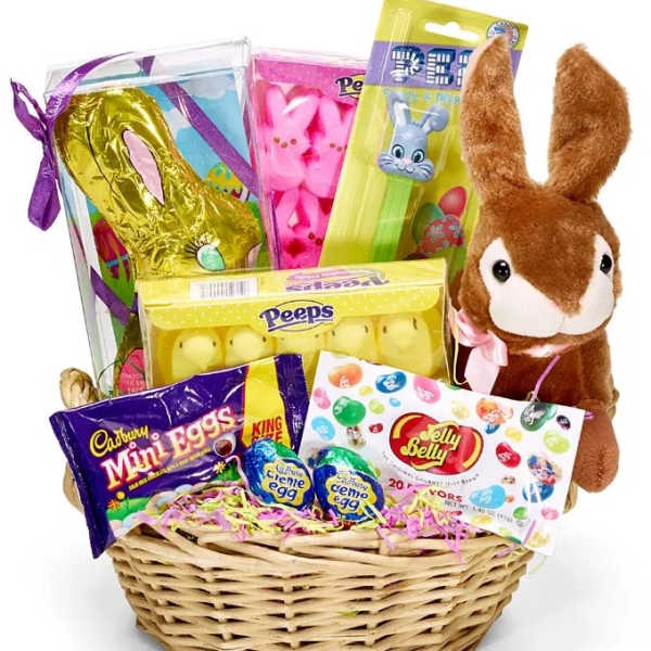Easter gift basket with candy packs and a plush bunny