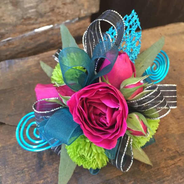 Bright pink rose with lime green and blue ribbon accents