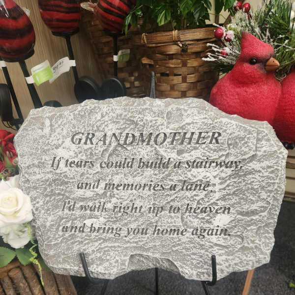 Memorial stone on a stand with engraved text