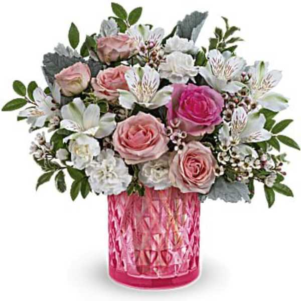 Pink and white rose bouquet in a textured pink vase