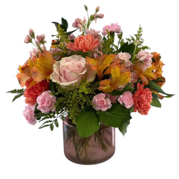 Mixed pink and orange bouquet in a glass vase