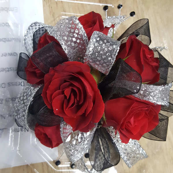 Bouquet of red roses with black and silver ribbon accents