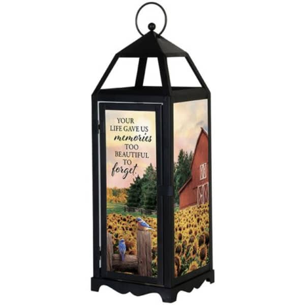 Black memorial lantern with sunflower field and barn scene panels and an inspirational quote.