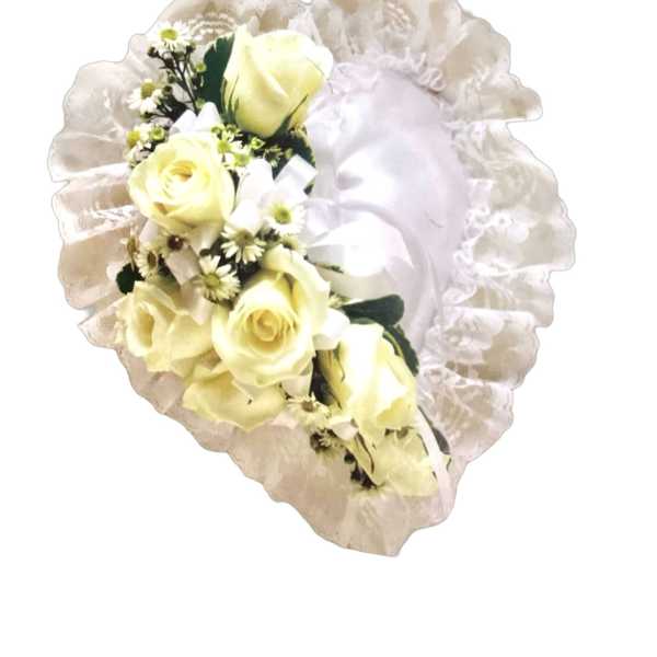 Cream rose bouquet with white filler flowers and a ruffled wrap