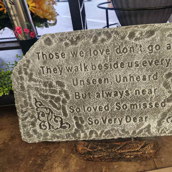 Memorial stone with an engraved sympathy poem