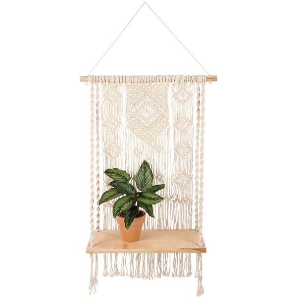 Potted plant on a hanging macrame shelf with a wooden board