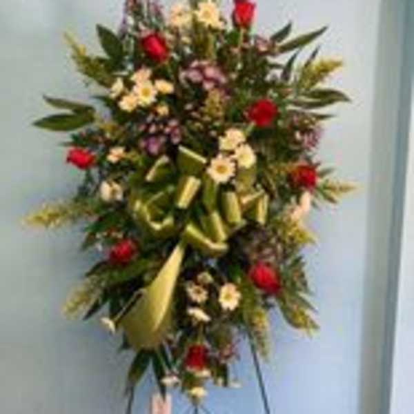 Tall standing floral spray with red and pale yellow flowers