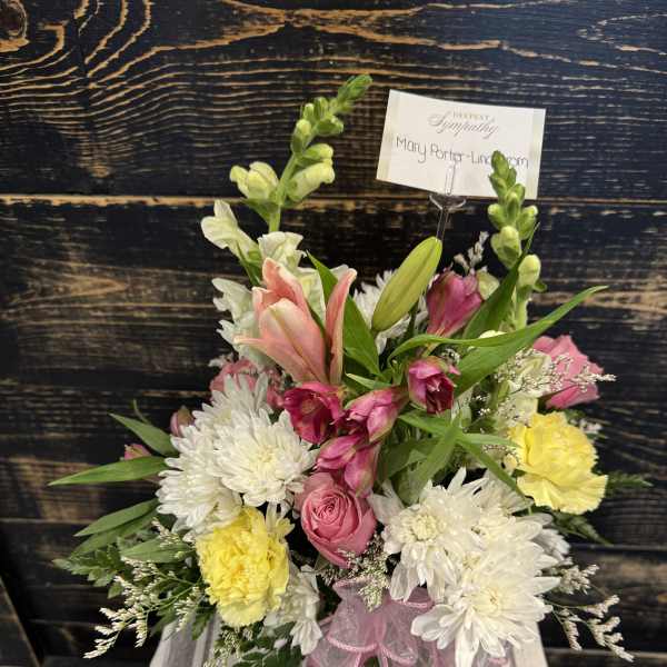 Pink and white mixed bouquet with lilies, roses, and carnations