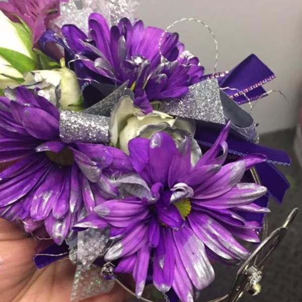 Purple daisy bouquet with silver ribbon and decorative wrap