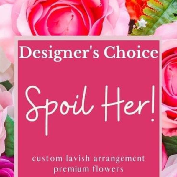 Pink floral sign reading "Designer’s Choice Spoil Her!"