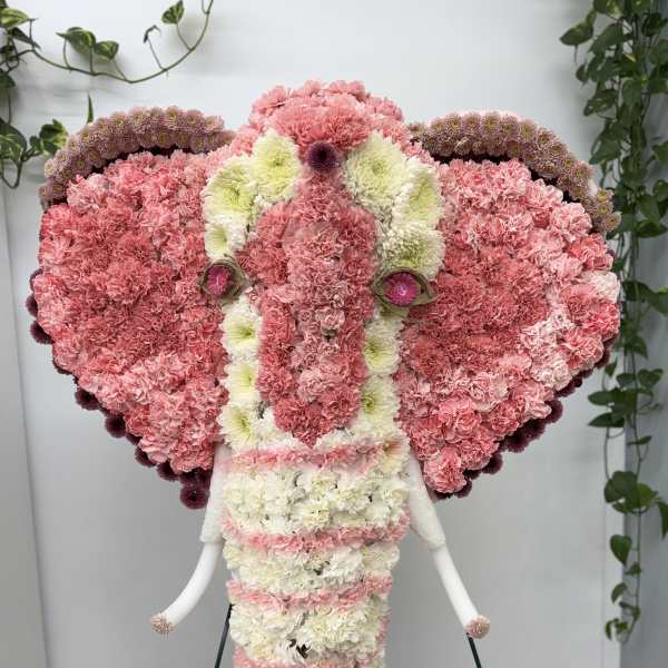 Elephant-shaped floral arrangement in pink and white carnations