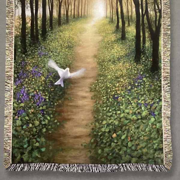 Fringed wall tapestry showing a forest path with a white dove