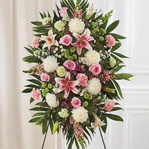 Standing floral spray with pink lilies, roses, and white blooms