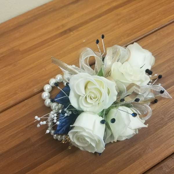 Small bouquet of white roses with pearl and ribbon accents
