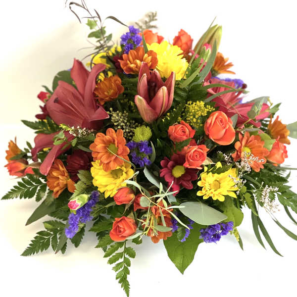 Mixed bouquet of orange, yellow, pink, and purple flowers