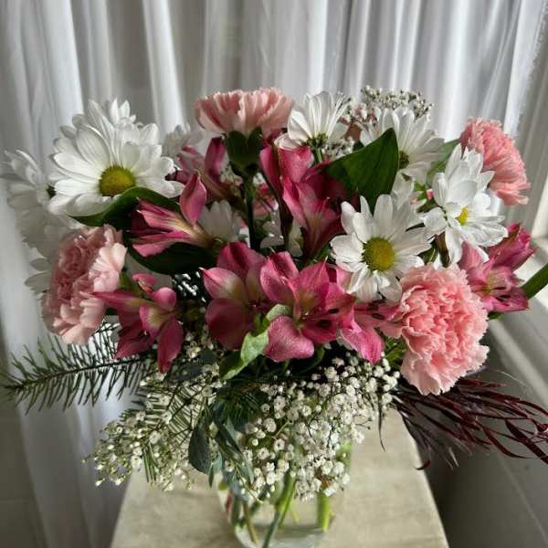 Pink and white mixed bouquet in a clear glass vase