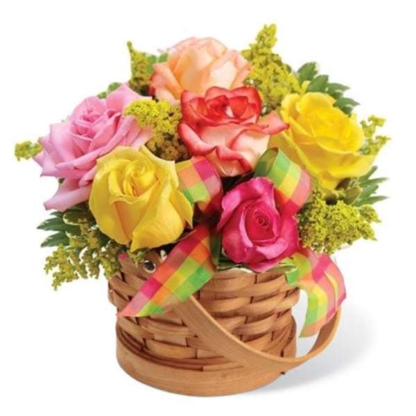 Basket of multicolored roses with rainbow ribbon