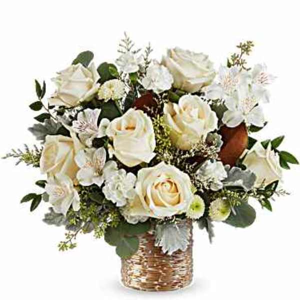 White rose bouquet in a woven gold vase