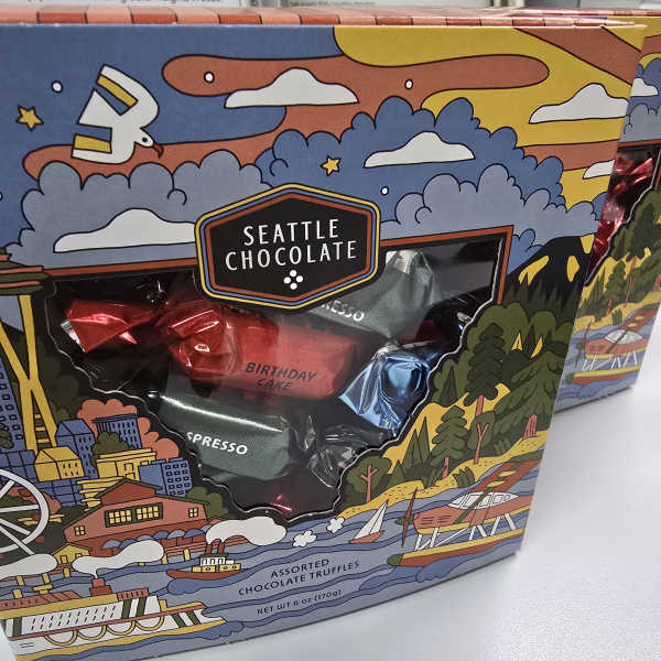 Box of Seattle Chocolate assorted truffles with colorful city-themed packaging