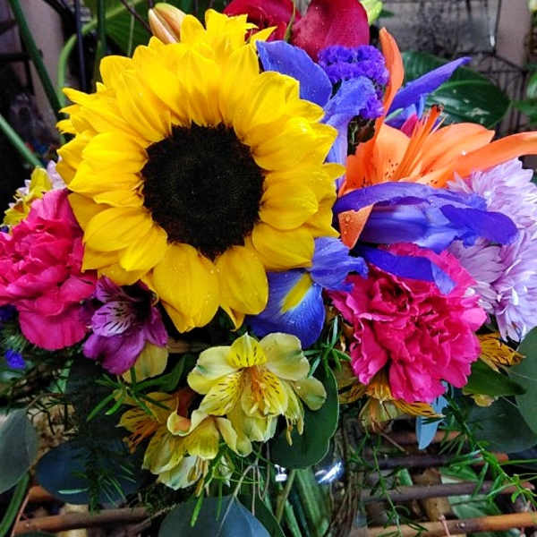 Bright mixed bouquet with a large sunflower and colorful blooms
