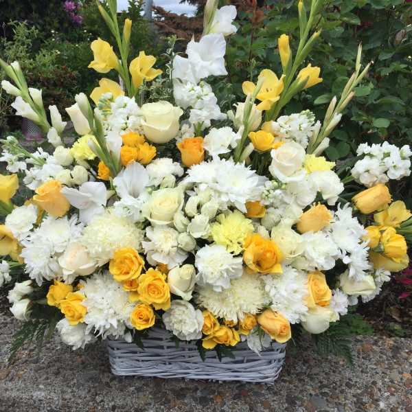Large yellow and white floral basket arrangement